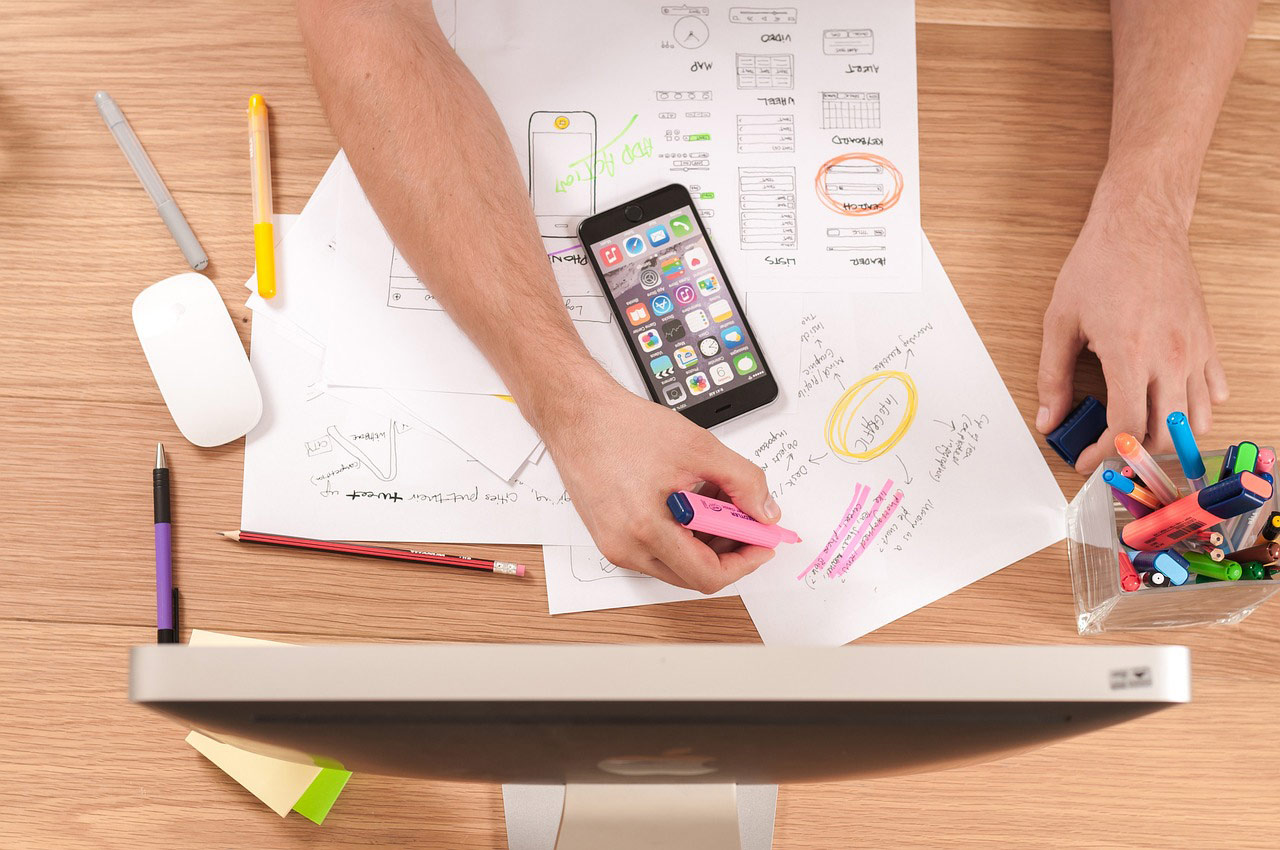 Person at desk trying to organize