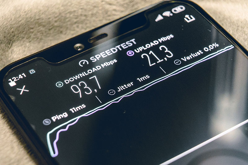 What Do Internet Speeds Mean GBPS MBPSS Smart phone conducting a speed test